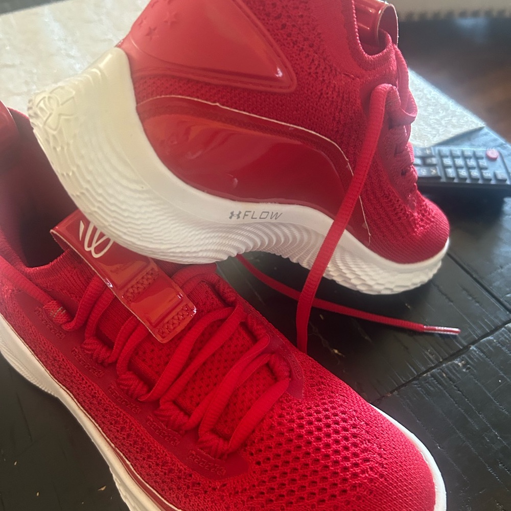 Curry’s Under Armour Red and White Sneakers with Modern Design
